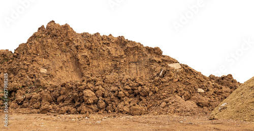 Brown mound isolates dug up and left on the ground to prepare for landfill to improve construction in rural Thailand.