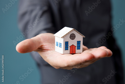 Model house in man hand