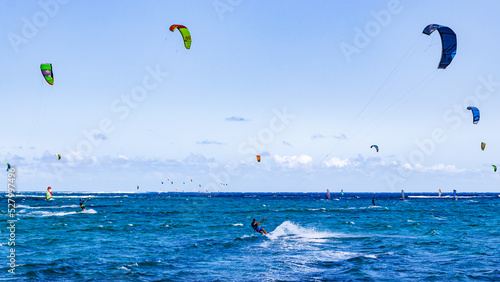 Hundreds of kite surfers enjoy the wind on the southern tip of the Bay of Le Morne in Mauritius