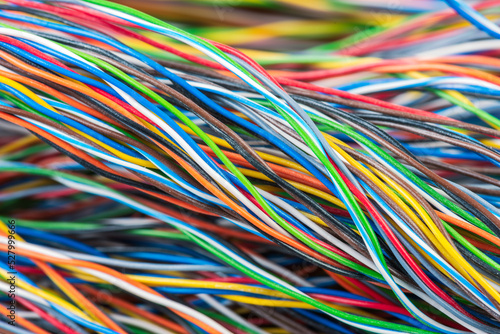 Close-up multicolored telecommunication electrical cables with white sliding power