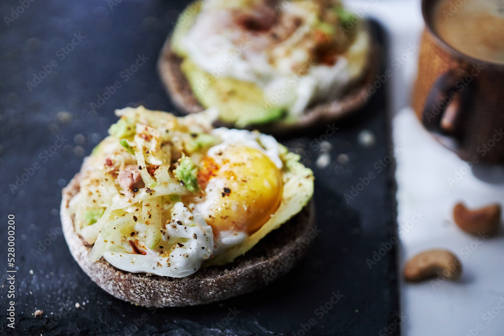 homemade delicious toast, topped with egg, tuna, cucumber and avocado