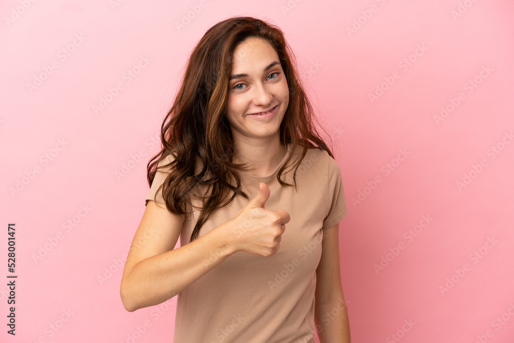 Young caucasian woman isolated on pink background giving a thumbs up gesture Young caucasian woman isolated on pink background giving a thumbs up gesture