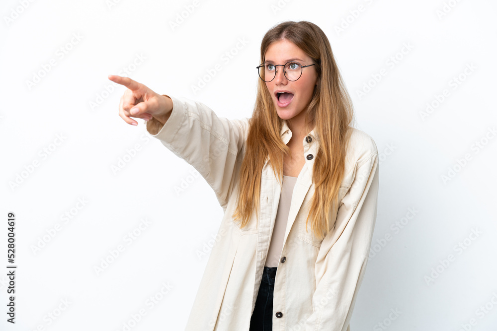 Young blonde woman isolated on white background pointing away Young blonde woman isolated on white background pointing away