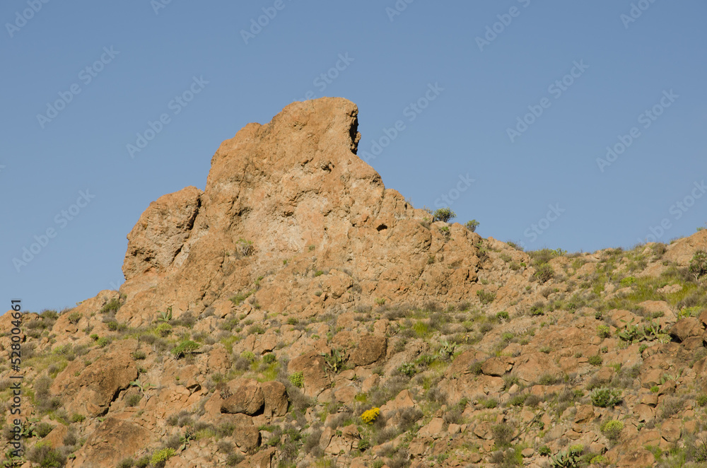 Rocky cliff and slope. Chira. San Bartolome de Tirajana. Gran Canaria. Canary Islands. Spain.