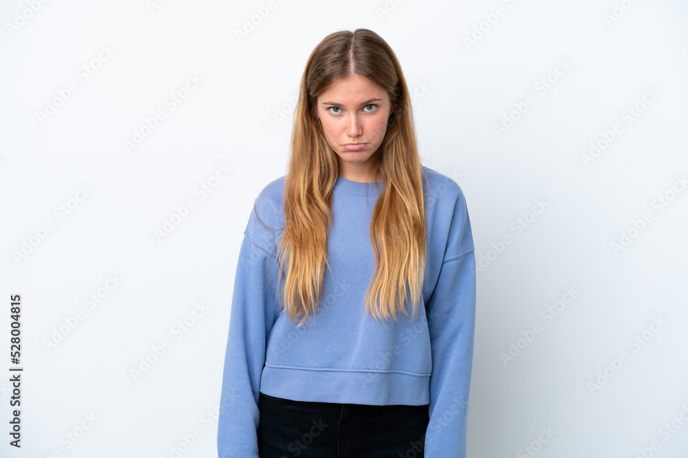 Young blonde woman isolated on white background with sad expression Young blonde woman isolated on white background with sad expression