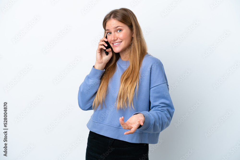 Young blonde woman isolated on white background keeping a conversation with the mobile phone with someone Young blonde woman isolated on white background keeping a conversation with the mobile phone with someone