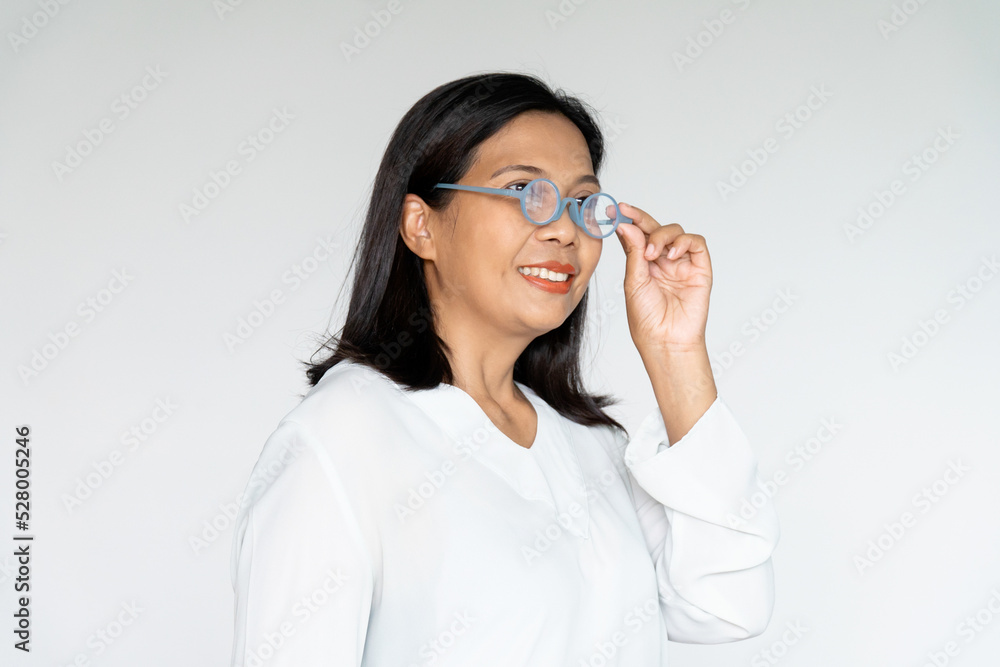 Business Woman Grab Her Glasses with Sincere Smiling on White background Business Woman Grab Her Glasses with Sincere Smiling on White background