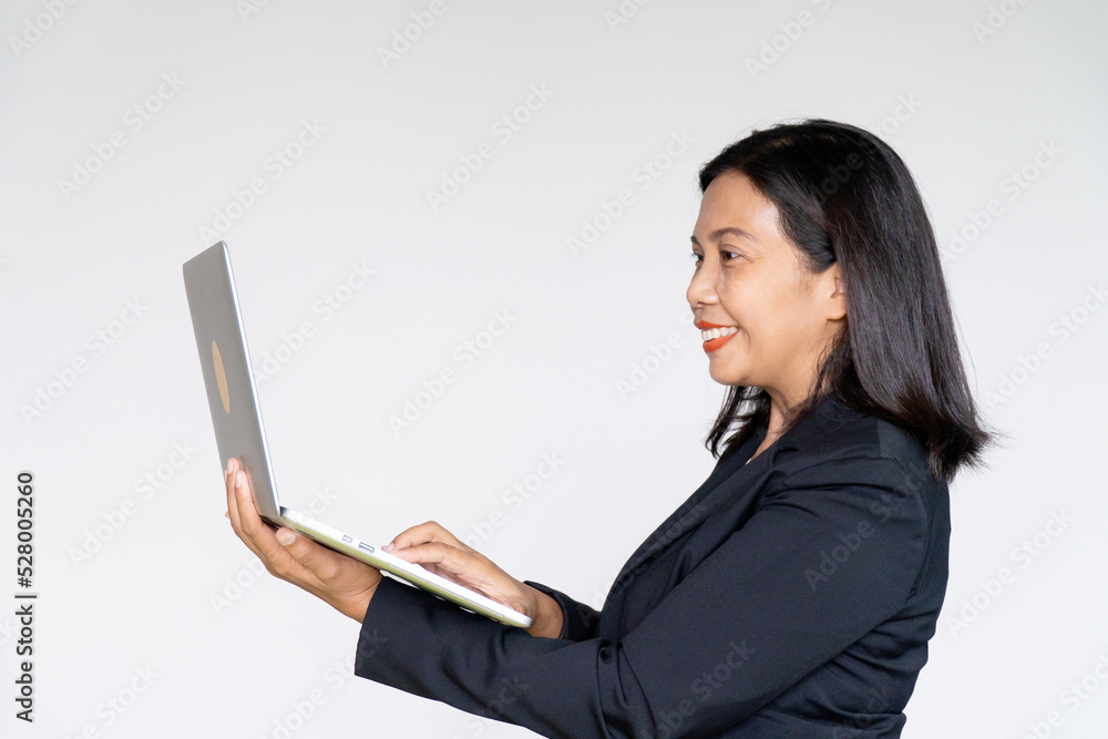 Business Woman Wearing Black Suit Jacket Holding and Looking on Her Laptop on White background Business Woman Wearing Black Suit Jacket Holding and Looking on Her Laptop on White background