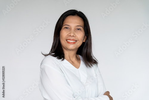 Business Woman Standing and Cross Her Arm with Sincere Smiling on White background