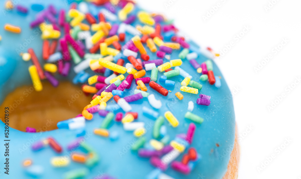 Macro shot of colorful sprinkles on a donut. Background banner. Free space.