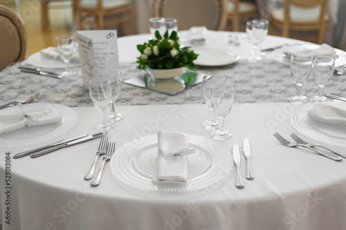 Tables set for the holiday in the restaurant © Alona Dudaieva