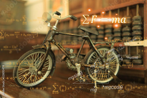 Sir Isaac Newton's equations of motion, sigma F equal to m multiply by a, and the background of machines such as bicycles convey the utilization of energy and motion. photo