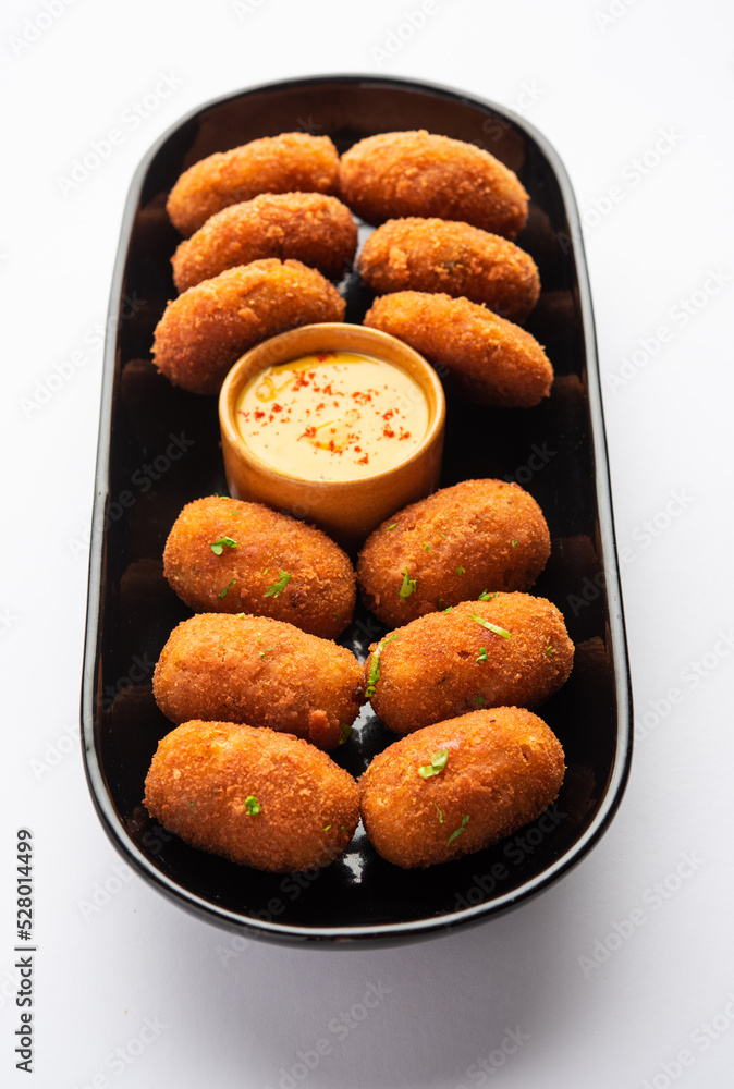 Macher Chop - Bengali style fish cutlet or pakora, a popular festival snack from west Bengal Macher Chop - Bengali style fish cutlet or pakora, a popular festival snack from west Bengal