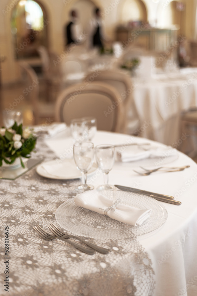 Tables set for the holiday in the restaurant Tables set for the holiday in the restaurant