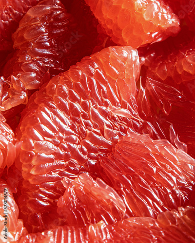 CLose-up of peeled red grapefruit segments