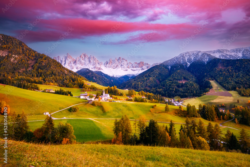 Autumn morning in St. Magdalena village with Odle range. Dolomite alps, Italy, Europe.