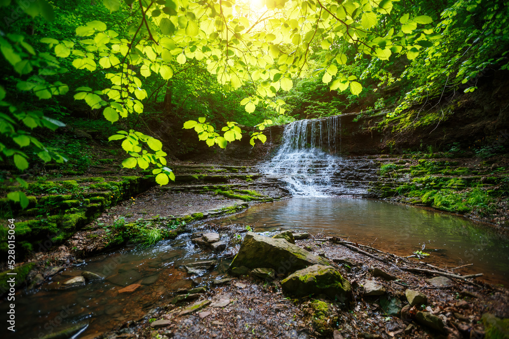 Obraz premium Gorgeous view of the unique waterfall on a sunny day. Carpathian, Ukraine.