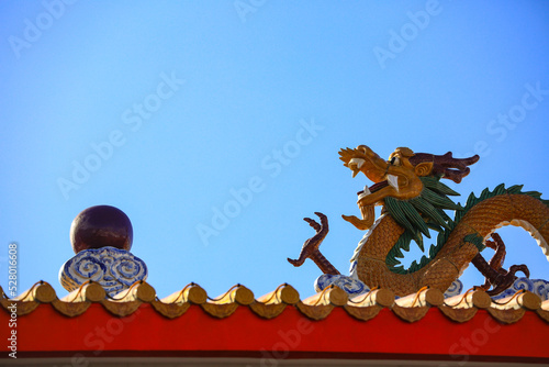 Beautiful dragon statue on chinese temple roof © aylerein