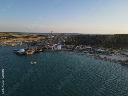 Aerial view of Zrce Beach Festival in Novalja, island Pag, archipelago of Croatia. People partying on a hot summer day on Zrce beach. Zrce beach is the most popular party destination on Adriatic sea. © AerialDronePics