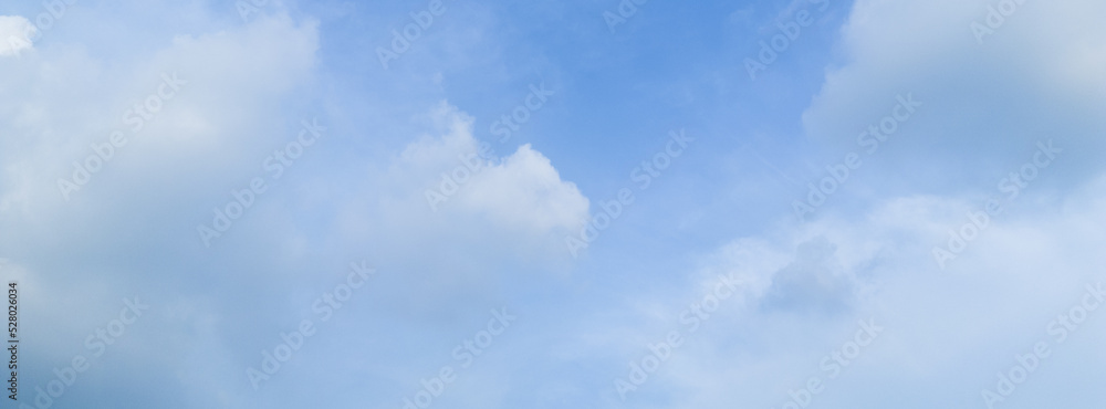 Obraz premium Abstract blue sky white cloud on the light of the sun background with empty copy space for add text or advertise design creative