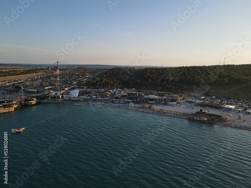 Aerial view of Zrce Beach Festival in Novalja, island Pag, archipelago of Croatia. People partying on a hot summer day on Zrce beach. Zrce beach is the most popular party destination on Adriatic sea. © AerialDronePics