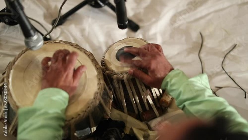 A Slow Motion Shot of a man Playing Tabla at an Indian Wedding in New Delhi,India