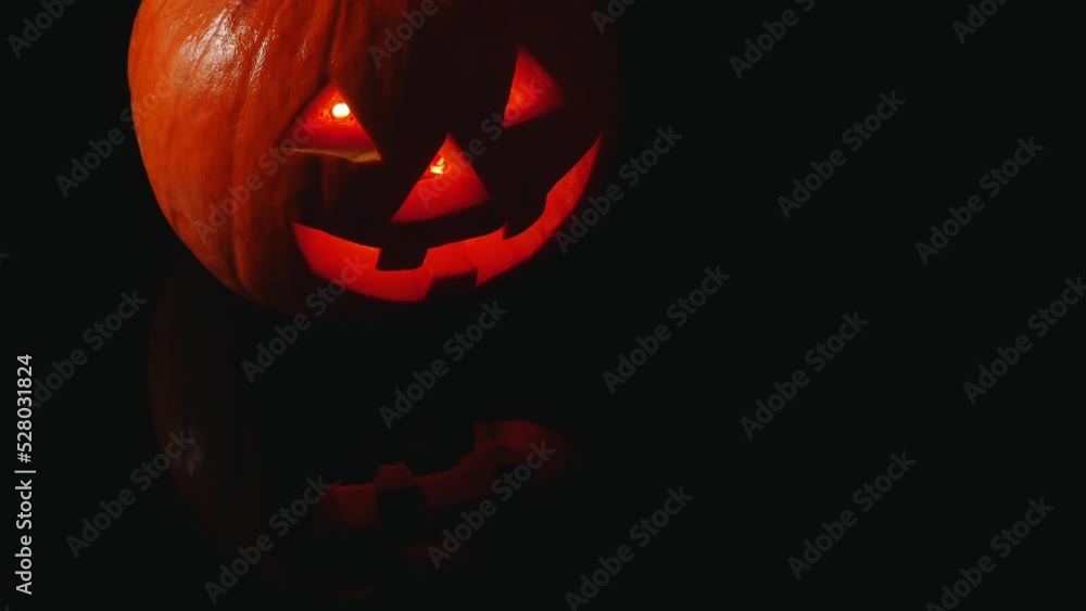 Halloween glowing pumpkin on black background Halloween glowing pumpkin on black background