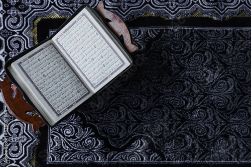 The Holy Al Quran with written Arabic calligraphy. 