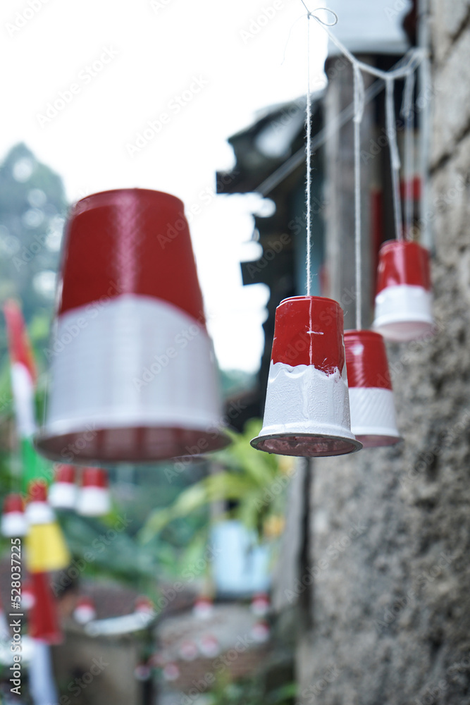 decoration of the red and white flag representatives using colored drinking cups to celebrate Indonesian independence day