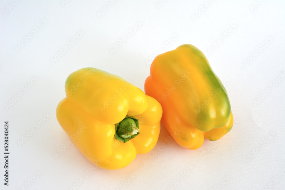 two sweet yellow peppers isolated on white background, close-up two sweet yellow peppers isolated on white background, close-up