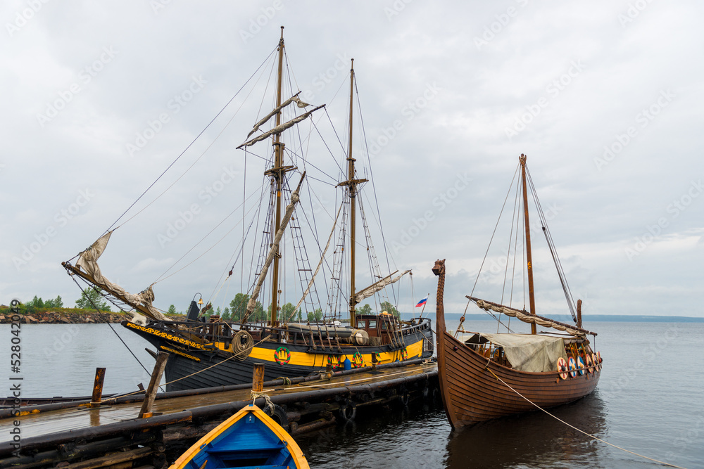 Two wooden sailing ships at the pier