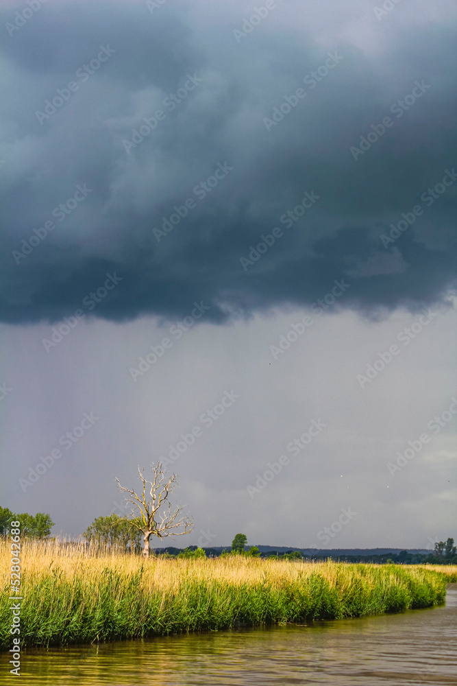 Heavy rain storm clouds wind waves water Oste river Germany. Heavy rain storm clouds wind waves water Oste river Germany.