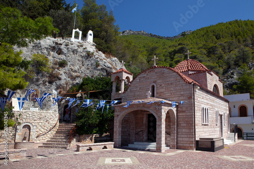 Τhe church of the Dormition of the Virgin ,in the monastery of Saint Patapios  in Loutraki,Corinthia, Peloponnese,  Greece. Sunny summer day with blue sky photo
