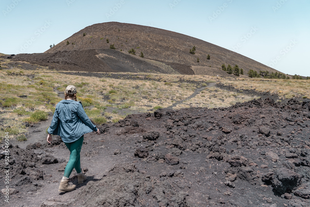 Woman hiking on Mount Etna. It's a active vulcano in Sicily.
