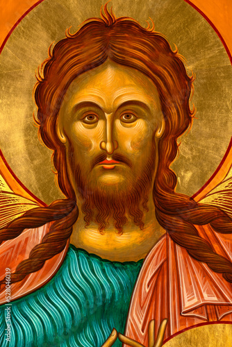 Byzantine Style Orthodox Icon depicting St. John the Baptist portrait, face detail. photo