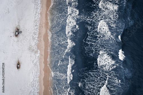 Top view of fishing boats at Baltic Sea in winter