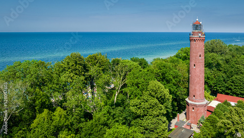 Lighthouse by Baltic sea, Poland. Tourism at Baltic Sea, Poland.