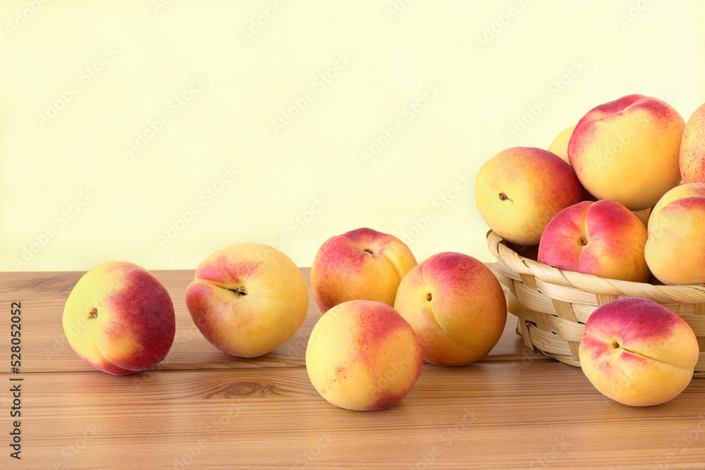 Apricots in wicker basket on the table Apricots in wicker basket on the table