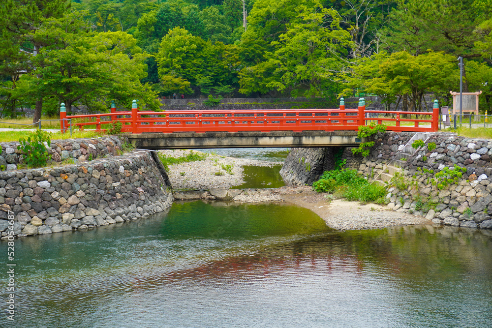 Fototapeta premium Uji river and To no Shima, Tachibanajima Island in Uji, Kyoto, Japan