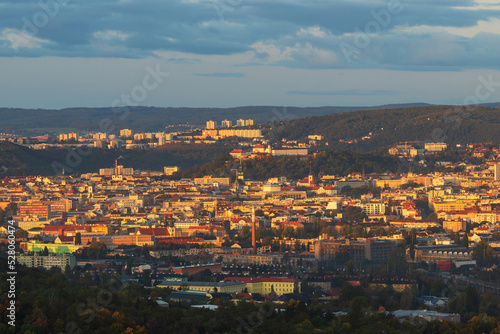 View of the city of Brno - Czech Republic - Europe. In the middle is the dominant Spilberk. The city is illuminated by the setting sun. © Roman Bjuty