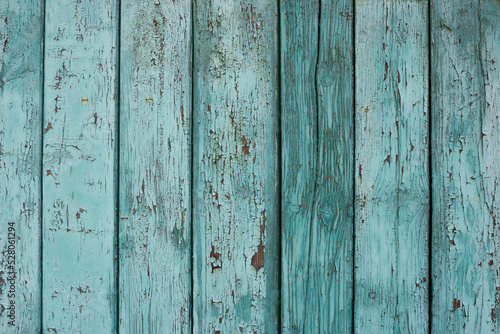 Wood background texture. Wooden surface, old boards, blue-green paint, blank retro template for advertising lettering, rough material, grungy textured background closeup.