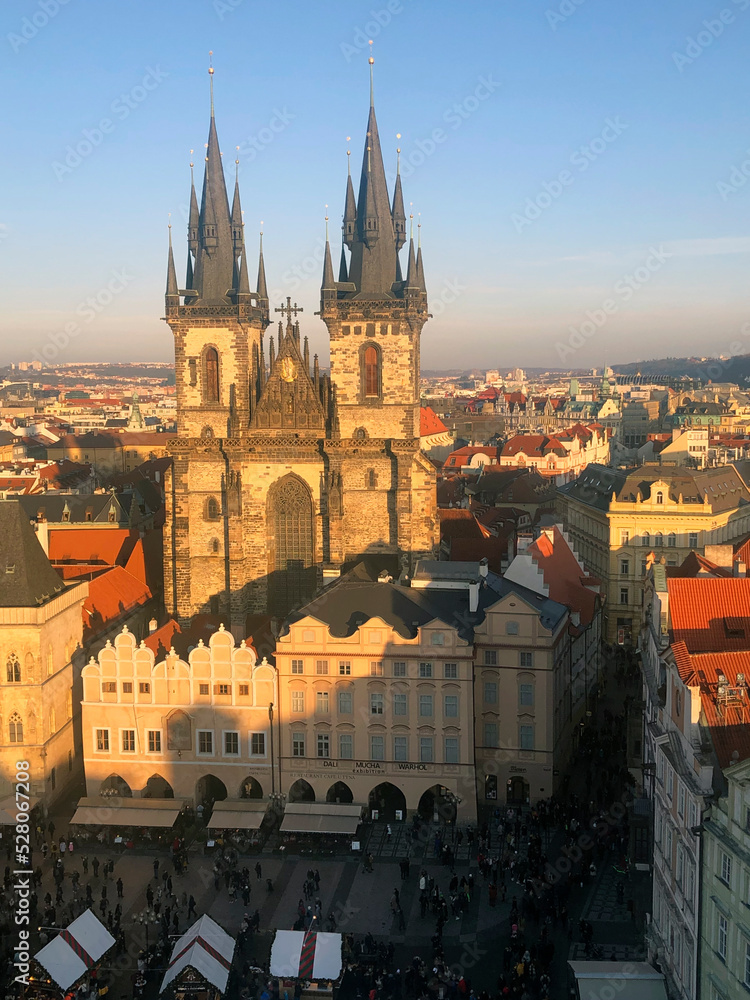 Impressive Prague Church of Our Lady before Týn with a Christmas market. New Year in Czech Republic. Old Town Square on a sunny day