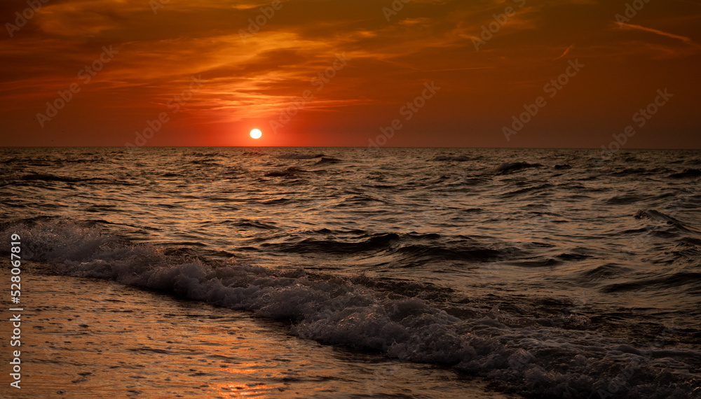 sunset in the summer evening by the sea , Baltic sea in the evening sunset in the summer evening by the sea , Baltic sea in the evening