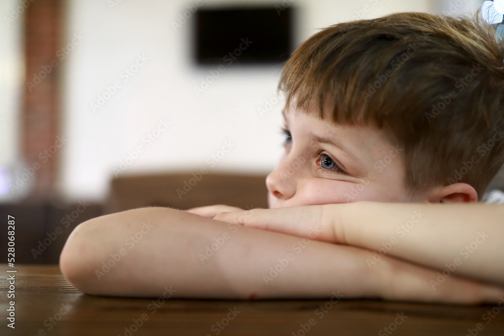 Child waiting food in restaurant Child waiting food in restaurant