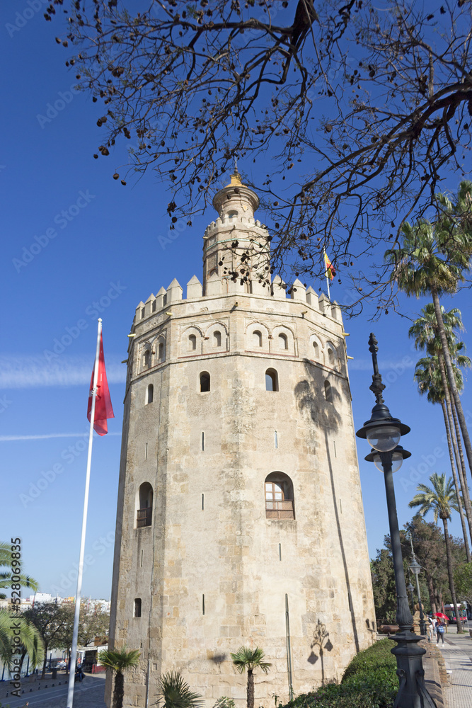 Bottom view of Golden tower or Torre del Oro, a medieval military control tower on riverside of Seville, Andalusia, Spain.