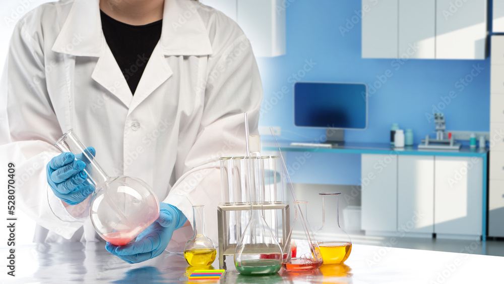 Fototapeta premium Biologist at work. Bio specialist in laboratory. Human chemist. Employee of chemical laboratory. Scientist works in laboratory. Lab technician hands with tubes. Biologist in white coat