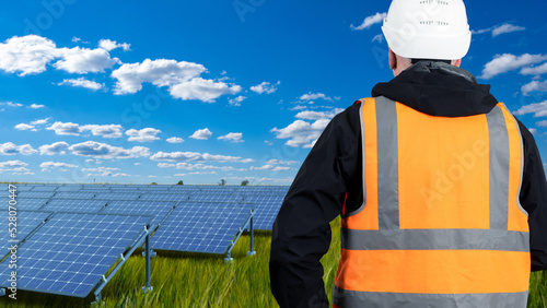 Solar power farm. Engineers...