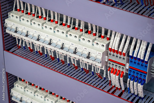 Voltage switchboard with circuit breakers. Electric equipment. White automata for energy control. Electric switchboard with wires connected. Supply electricity. Switchboard inside close-up