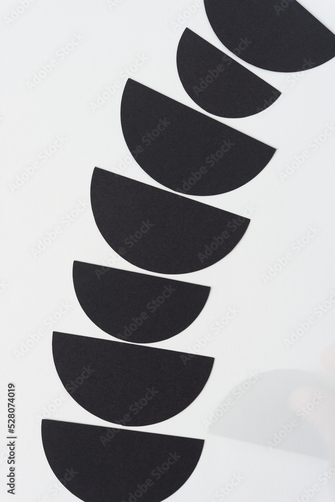 abstract black and white paper background with semi circle motif - with ghost image