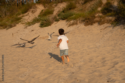Sarbinowo poland August 2022, unidentfied children play by the Baltic sea in the evening photo